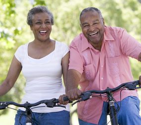 a woman bike riding with her husband to represent life with perimenopause