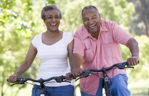 a woman bike riding with her husband to represent life with perimenopause