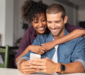 a man and a woman excited about their early pregnancy