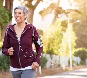 a senior woman going for a jog to represent the importance of exercise in the post menopausal years