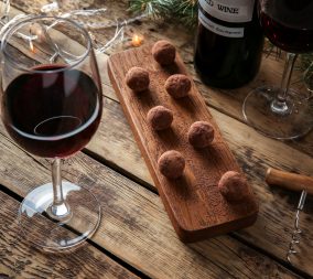 A tablescape with red wine and chocolate to represent a heart healthy valentine's day