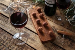 A tablescape with red wine and chocolate to represent a heart healthy valentine's day