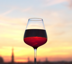 A glass of red wine to symbolize alcohol in pregnancy and alcohol's role in breastfeeding