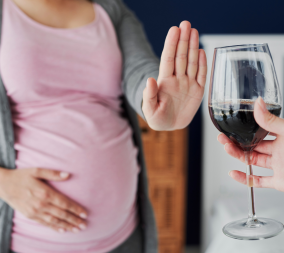 A pregnant woman refusing alcohol