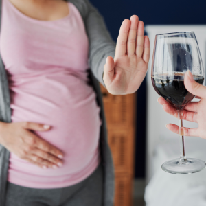 A pregnant woman refusing alcohol