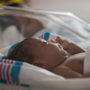 A new born baby to represent the questions about delayed cord clamping
