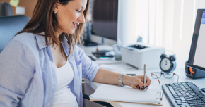 A pregnant woman doing research on a laptop to figure out if she should eat her placenta