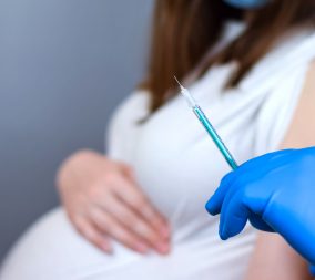 a woman getting a covid-19 vaccine in pregnancy