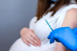 a woman getting a covid-19 vaccine in pregnancy