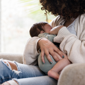 A mom breastfeeding to represent the maternal benefits of breastfeeding