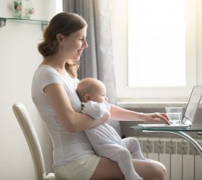 A mom with a baby research postpartum birth control options