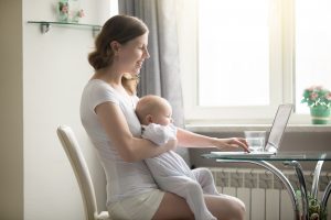 A mom with a baby research postpartum birth control options